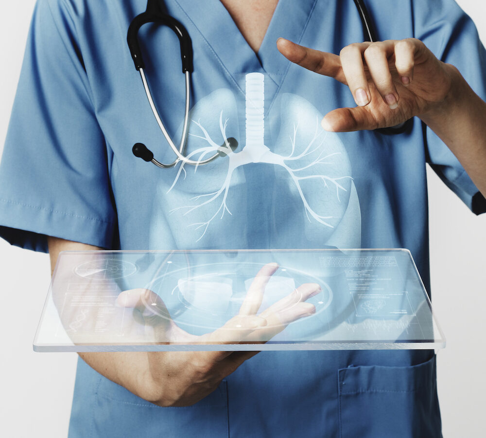 Doctors using transparent tablet with hologram medical technology