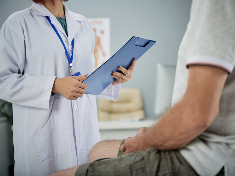 Medical practitioner asking patient questions from the list